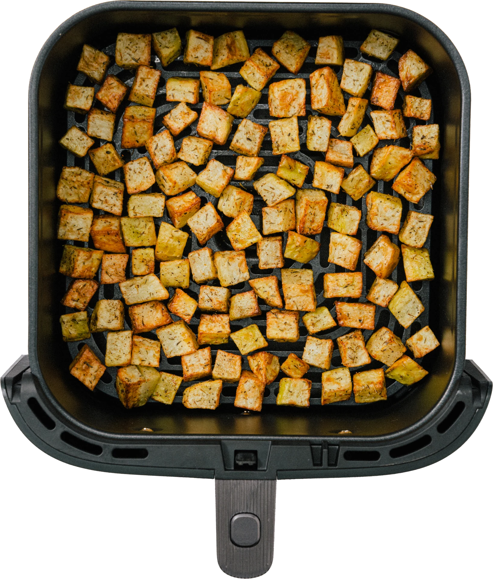 A close-up view of a black air fryer basket filled with evenly cooked, golden-brown diced potatoes.